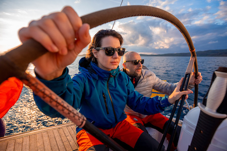 picture of helmsman and crew member on sailing yacht